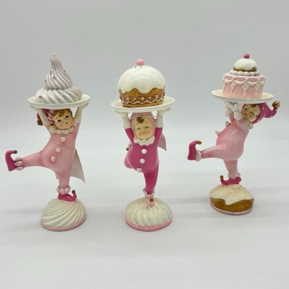 Pink gingerbread kids carrying cakes - Picture 1 of 7